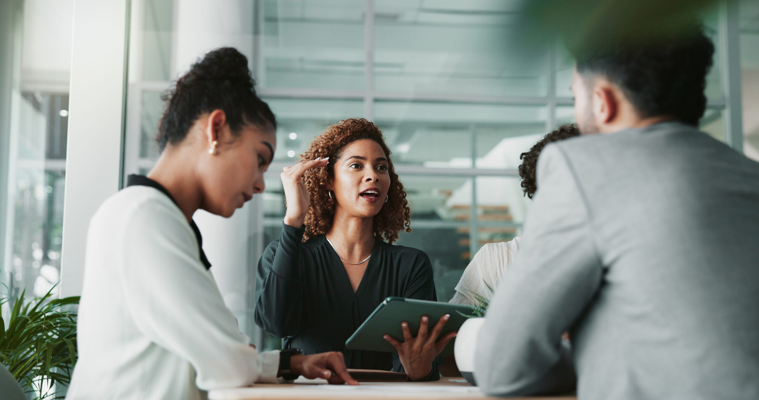Bookkeeping professional speaking to her clients during a meeting